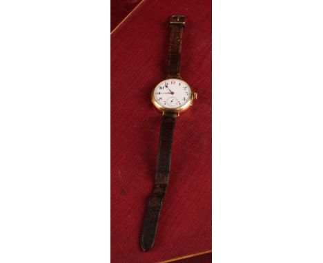 Longines - an 18ct gold trench wristwatch, 30mm diameter case, white enamel dial, black Arabic numerals with red 12 o'clock, 