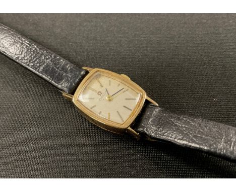 Omega - a 1960s 9ct gold cased lady's wristwatch, ref 1061, 16mm wide tonneau case, brushed silver dial, block baton markers,