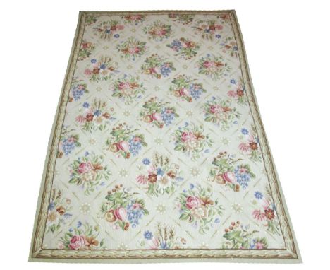 FINE AUBUSSON PETIT POINT CARPET, 265cm x 175cm, floral bouquets on an ivory field.