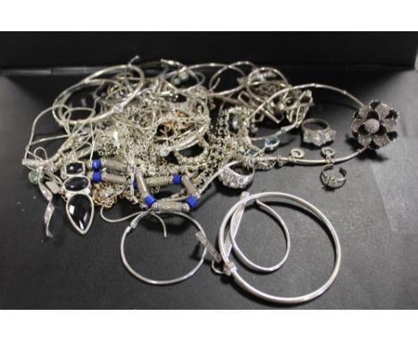 A BAG OF WHITE METAL COSTUME JEWELLERY 