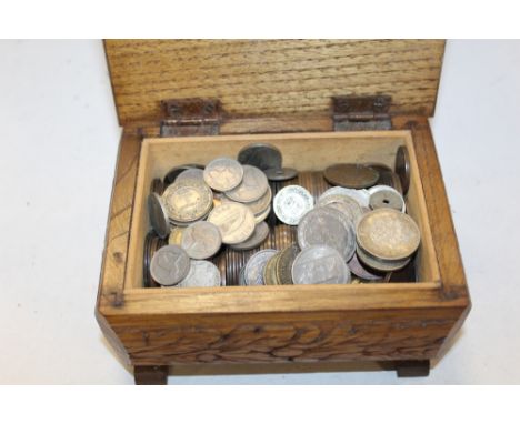 A CARVED OAK LIDDED BOX CONTAINING ANTIQUE AND VINTAGE WORLD COINAGE