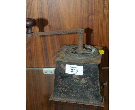 AN ANTIQUE COFFEE BEAN GRINDER 