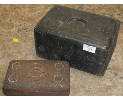 A VINTAGE LEATHER COATED JEWELLERY BOX, TOGETHER WITH A HEAVILY CARVED WOODEN BOX (2) 