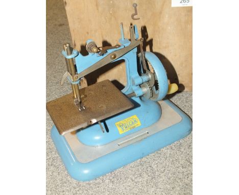A VINTAGE VULCAN MINIATURE SEWING MACHINE IN WOODEN BOX A/F 