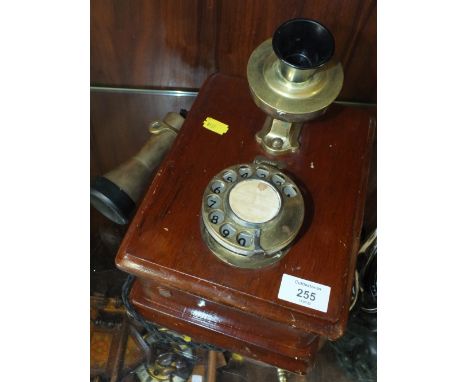 A VINTAGE MAHOGANY AND BRASS WALL HANGING TELEPHONE MARKED MKXVAP TELE MFG CO LONDON 