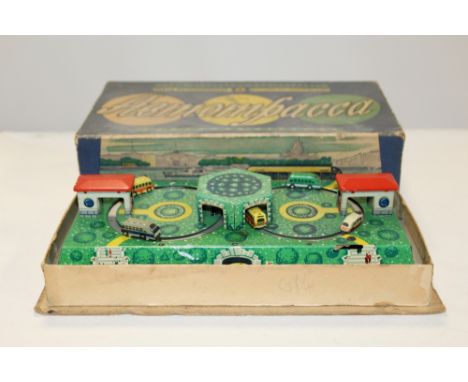 A BOXED VINTAGE WIND UP TIN PLATE BUS TOY WITHY KEY  