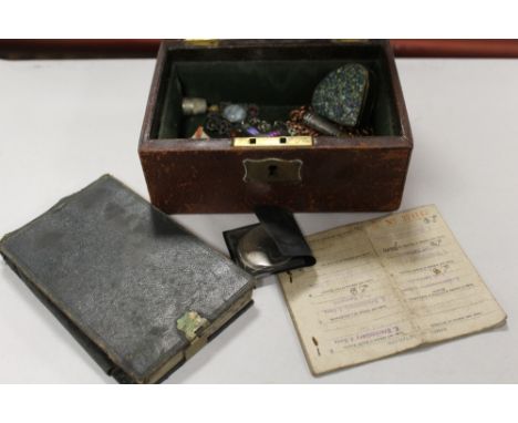 AN ANTIQUE LEATHER COATED BOX CONTAINING COSTUME JEWELLERY AND COLLECTABLES TO INCLUDE A HALLMARKED SILVER CHEROOT HOLDER, SM