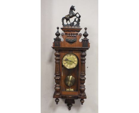 A 19TH CENTURY VIENNA WALLCLOCK WITH HORSE FINIAL, overall H 99 cm, W 30 cm