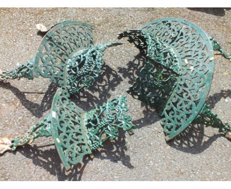 A METAL GARDEN BENCH TREE SURROUND