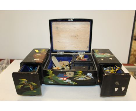 A LACQUER JEWELLERY BOX AND COSTUME JEWELLERY