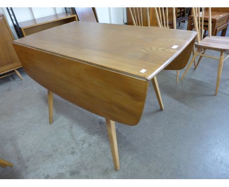 An Ercol Blonde elm and beech  Windsor drop leaf table 