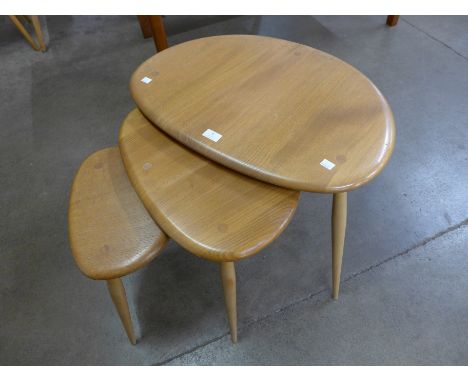 An Ercol Blonde elm and beech pebble shaped nest of tables 