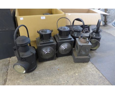 Assorted vintage and later railway lamps, three cast iron flat irons and a vintage brass blow lamp 