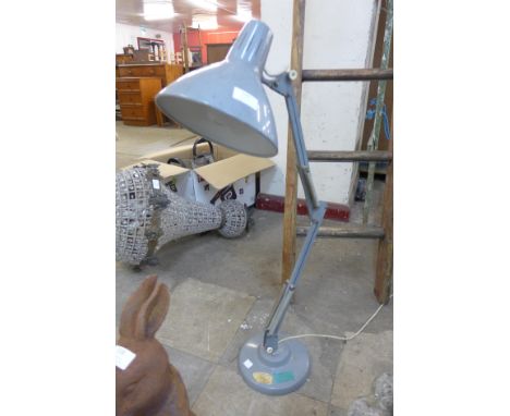 A grey metal anglepoise desk lamp 