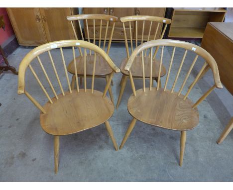 A pair of Ercol Blonde elm and beech 449A model cow horn chairs and another pair of Ercol chairs 