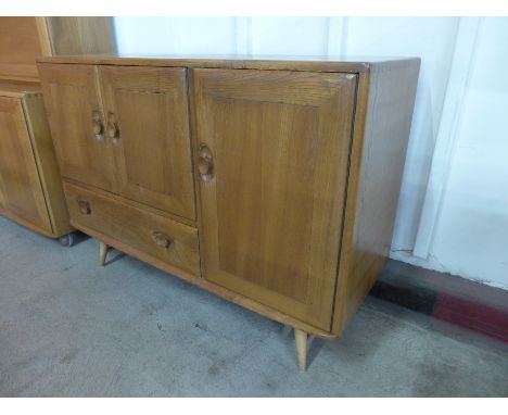An Ercol Blonde elm Windsor sideboard 