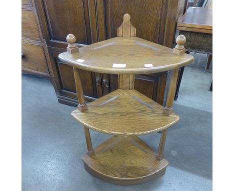 An Ercol Golden Dawn elm corner whatnot 