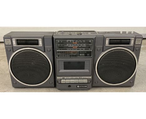 A portable Hitachi stereo radio cassette player. One speaker can detach. Complete with original lead. 