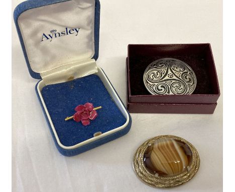 3 vintage brooches. A boxed large circular brooch with Celtic design by St. Justin. Together with a boxed Aynsley ceramic flo