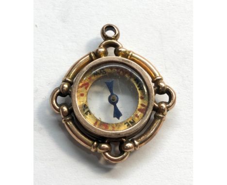 antique gold compass fob measures approx 30mm by 25mm not hallmarked but tested as gold 