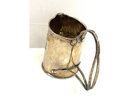 Silver (tested) Small arts and crafts cream jug, no hallmarks, approximate measurements: 5.5cm, approximate weight 47.8g 