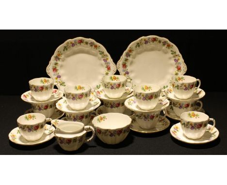 A Royal Crown Derby Melody pattern tea service for twelve comprising two cake plates, side plates, sugar bowl, cream jug, cup