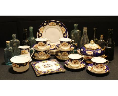 An early 20th century Salisbury China Derby Blue pattern tea service for six; an Imari pattern teapot; a similar teapot stand