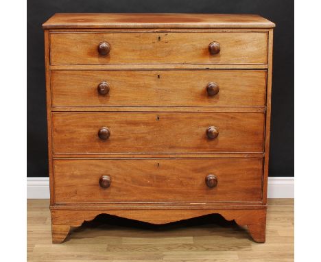 A Victorian mahogany chest, slightly oversailing top above four long graduated cockbeaded drawers, bun handles, shaped apron,