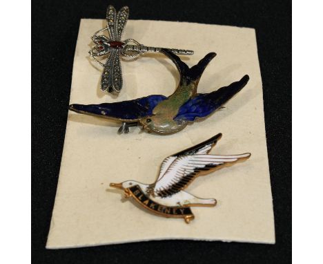 A 925 silver dragonfly brooch; an enamel Bluebird brooch; a Blakeney Seagull brooch (3) 