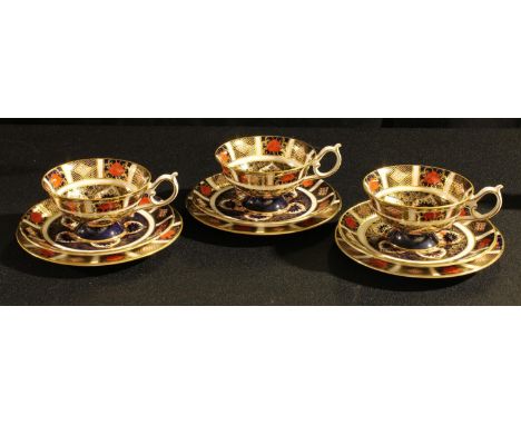 A set of three Royal Crown Derby 1128 pattern cups, saucers and side plates, first quality 