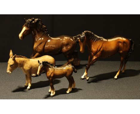 A Beswick model of a shire horse; others, foal, donkey; a Royal Doulton model of a horse (4) 