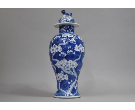 A 19th Century Chinese Blue and White Prunus Pattern Vase and Cover, Baluster Form, The Lid with Temple Lion Finial, Four Cha