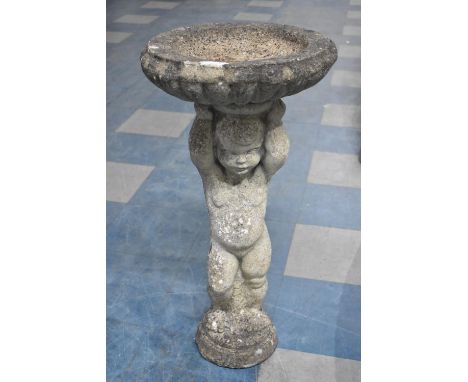 A Reconstituted Stone Garden Bird Bath with Cherub Support, 75cms High