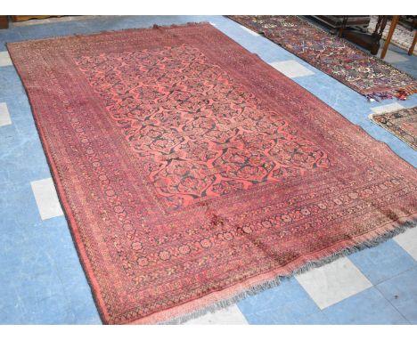 A Vintage Afghan Handmade Carpet on Red Ground, 292x198cm