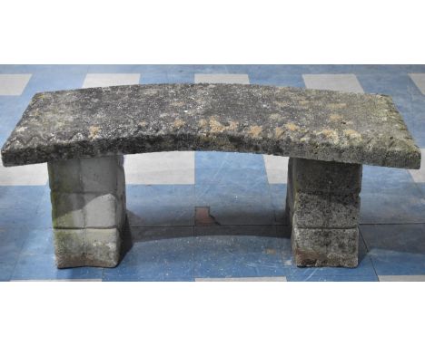 A Reconstituted Stone Crescent Shaped Garden Bench, 122cms Long