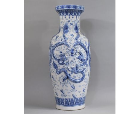 A Large Decorative 20th Century Chinese Blue and White Decorative Floor Vase, in Shallow Relief with Dragons Chasing Flaming 