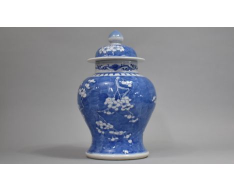 A 19th Century Blue and White Prunus Pattern Vase and Cover, Four Character Mark for Kangxi to Base, Squat Baluster Form, 33c