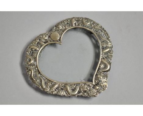 A Chinese Silver Heart Shaped Photo Frame with Repousse decoration depicting Dragons Chasing Flaming Pearl, Frame 14.7x13.5cm