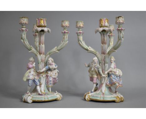 A Pair of Meissen Porcelain Three Branch Candelabras with Courting Lovers Beside Central Trunk Decorated in Pink, Blue and Gi