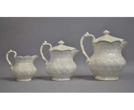 A Graduated Set of Three Mid 20th Century Don Pottery Creamware Tisanieres/Jugs decorated with Moulded Daisy Pattern, 23, 19 