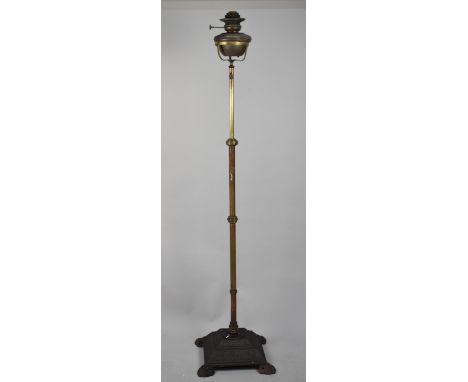 A Victorian Cast Iron and Brass Oil Lamp Stand with Copper Oil Lamp, 141cm high
