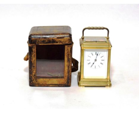 A Brass Striking and Repeating Carriage Clock, circa 1890, carrying handle and repeat button, enamel dial with Roman numerals
