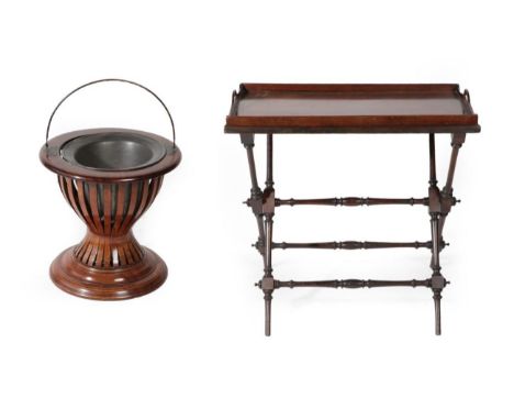 An Edwardian Mahogany and Line Inlaid Planter, early 20th century, of circular form with slatted body and moulded base, with 