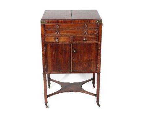 A George III Mahogany Washstand, late 18th century, the brass bound hinged lid enclosing a circular aperture for a wash bowl,