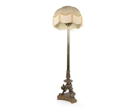 A Late 19th/Early 20th Century Brass Standard Lamp, the reeded column support and acanthus decorated base with gadrooned and 