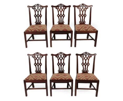 A Set of Six Victorian Chippendale Revival Carved Mahogany Dining Chairs, late 19th century, labelled Manufactured by Abbott 