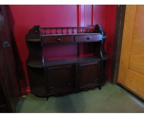 A late Victorian mahogany wall hanging cabinet the turned spindle gallery over two short drawers and open shelf with two door