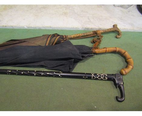 Two vintage umbrellas and an ebony walking stick with elephant head design (3)