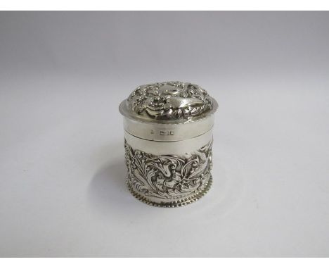 A William Comyns &amp; Son silver tea caddy with foliate scrolled embossing, vacant cartouche to lid, dated rubbed, London, 7