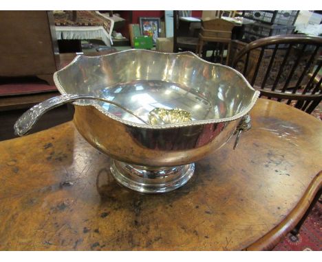 A silver on copper punch bowl with ladle 